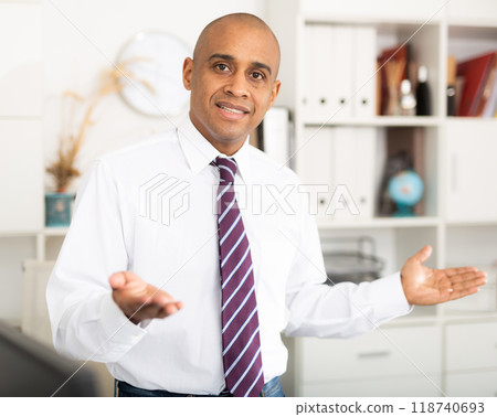 Latin American businessman standing in office 118740693