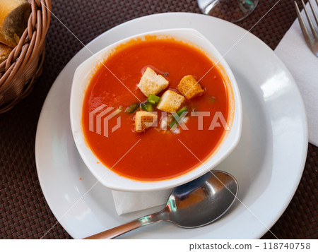 Traditional Andalusian cold soup gaspacho served with squabs, peppers and onions Traditional Andalusian cold soup gaspacho served with squabs, peppers and onions 118740758