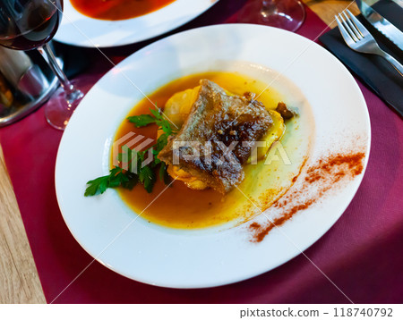 Baked boneless pork meat in gravy with stewed potatoes Baked boneless pork meat in gravy with stewed potatoes 118740792