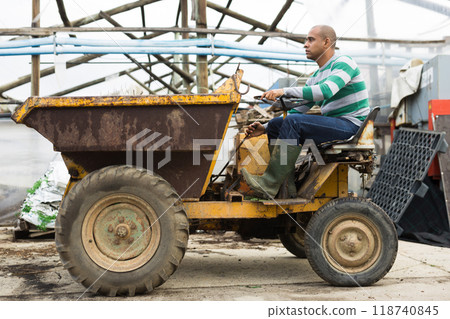 man working on Forklift loader 118740845
