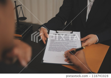 At a modern veterinary clinic, a Panshi Tzu puppy sits on an examination table. Meanwhile, a female veterinarian assesses the health  118741028