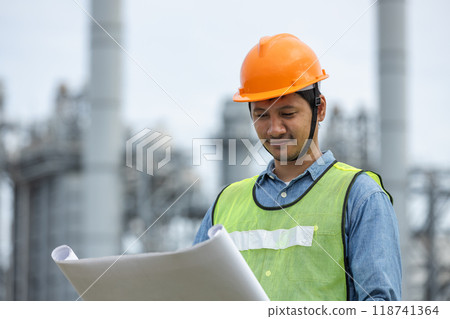Portrait of asian worker power plant factory holding blueprint thumb up and smiling. 118741364