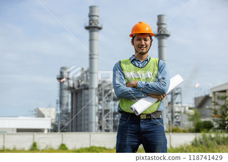 Portrait of asian worker power plant factory holding blueprint thumb up and smiling. Portrait of asian worker power plant factory holding blueprint thumb up and smiling. 118741429