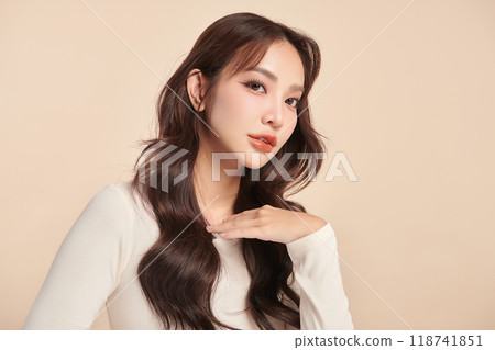 Beautiful young asian woman with clean fresh skin on beige background, Face care, Facial treatment, Cosmetology, beauty and spa, Asian women portrait. 118741851