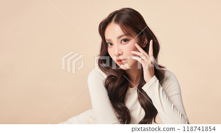 Beautiful young asian woman with clean fresh skin on beige background, Face care, Facial treatment, Cosmetology, beauty and spa, Asian women portrait. 118741854
