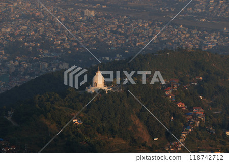 the outlook of Peace Pagoda in hill area with the townscape of Pokhara the outlook of Peace Pagoda in hill area with the townscape of Pokhara 118742712