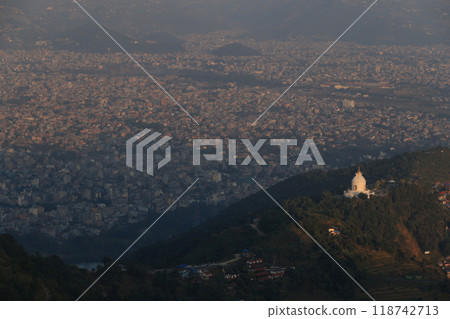 the outlook of Peace Pagoda in hill area with the townscape of Pokhara the outlook of Peace Pagoda in hill area with the townscape of Pokhara 118742713
