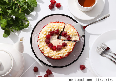 Red velvet cake, cup of tea, mint and berries on white background, top view Red velvet cake, cup of tea, mint and berries on white background, top view 118743130