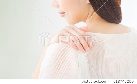 Young women suffering from stiff shoulders Young women suffering from stiff shoulders 118743296