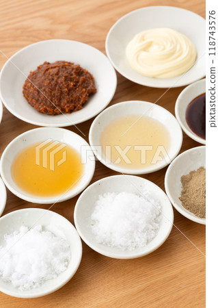 A collection of various condiments 118743576