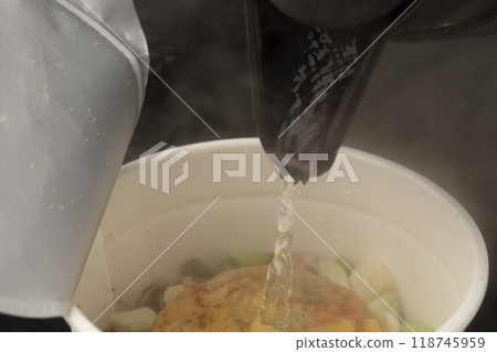 Pour hot water into instant noodles tempura soba 118745959