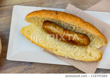 Sandwich bocadillo with fried bratwurst sausage on plate Sandwich bocadillo with fried bratwurst sausage on plate 118745989