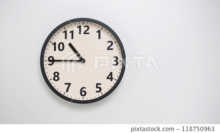 Classic Black-Edged Clock on White Background at 22.45/10.45 - Perfect for Time Management and Text Space Classic Black-Edged Clock on White Background at 22.45/10.45 - Perfect for Time Management and Text Space 118750963