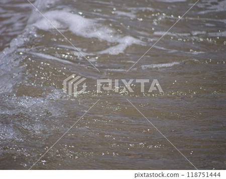 Ocean waves breaking at the beach Ocean waves breaking at the beach 118751444