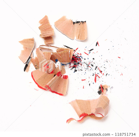Wood shavings from multi-colored wooden pencils on white background, top view 118751734