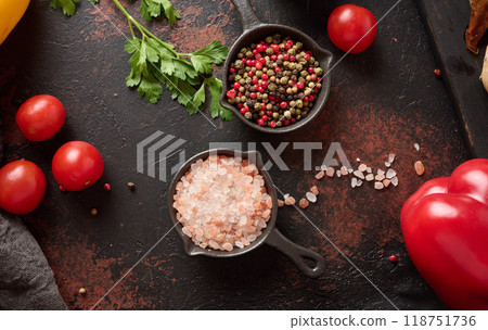 Culinary composition with kitchen utensils and spices, Himalayan salt, colorful peppercorns on the table 118751736