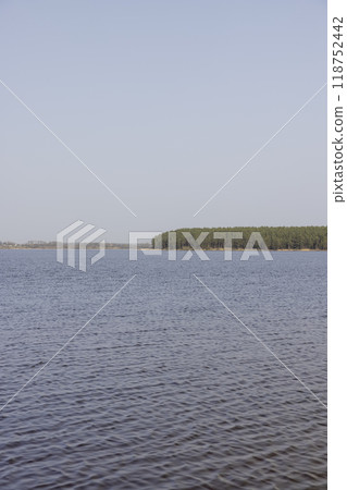 dark muddy lake water in winter without snow 118752442