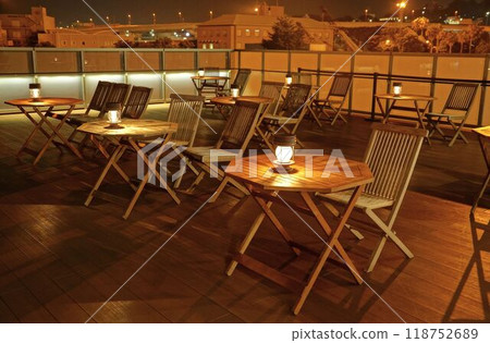 Wooden table, chairs and lamps outside Wooden table, chairs and lamps outside 118752689