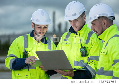 Team professional electrical engineer safety uniform working together power plant  118753761