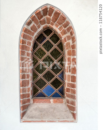 Medieval window with stained glass in historical church Medieval window with stained glass in historical church 118754120