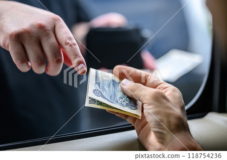 Male hand giving money 118754236