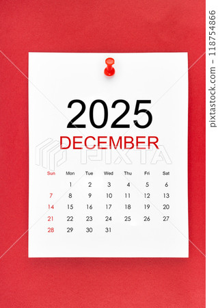 December 2025 calendar page with push pin on red background. December 2025 calendar page with push pin on red background. 118754866