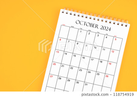 October 2024 desk calendar on yellow color background, position with copy space. 118754919