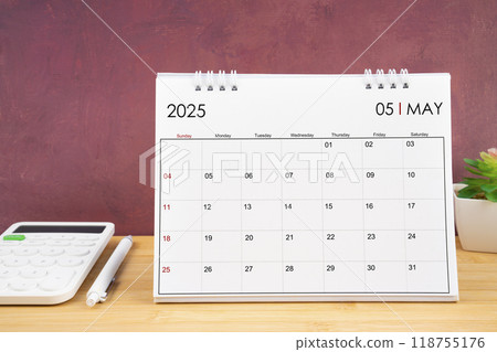 May 2025 white calendar and calculator with pen. May 2025 white calendar and calculator with pen. 118755176