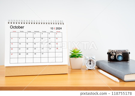 Desktop Calendar for October 2024 year and vintage camera with diary for Planner to plan timetable. 118755178