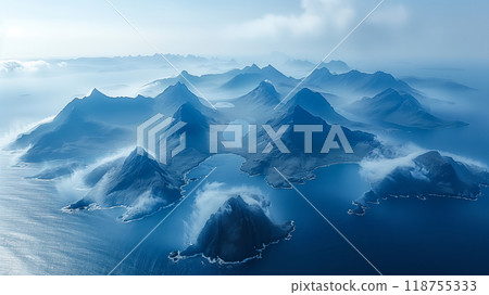 Majestic Aerial View of Mist-Covered Mountain Peaks and Serene Ocean Waters in a Remote Landscape 118755333