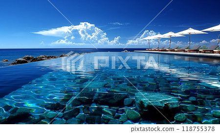 Stunning Infinity Pool With Crystal Clear Water Overlooking Calm Ocean Waves on a Sunny Day 118755378