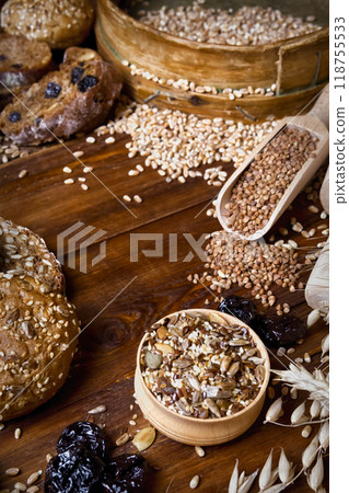 Assortment of baked bread on wooden table background 118755533