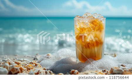 Refreshing orange drink with ice on sandy beach by the ocean waves. Generative AI 118756644