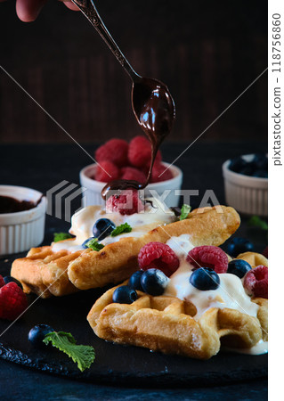 still life Belgian waffles on dark background still life Belgian waffles on dark background 118756860