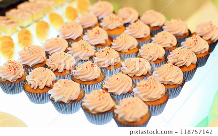 Beautiful multicolored decorated baked sweet tasty party cakes or catering cakes for party, bar dessert selection with cake, pie and pastries catering banquet, coffee break buffet at a conference 118757142