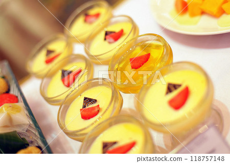 Beautiful multicolored decorated baked sweet tasty party cakes or catering cakes for party, bar dessert selection with cake, pie and pastries catering banquet, coffee break buffet at a conference 118757148