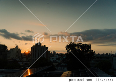 sunset over a residential area sunset over a residential area 118757334