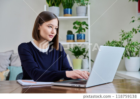Young female using computer laptop for studying working 118759138