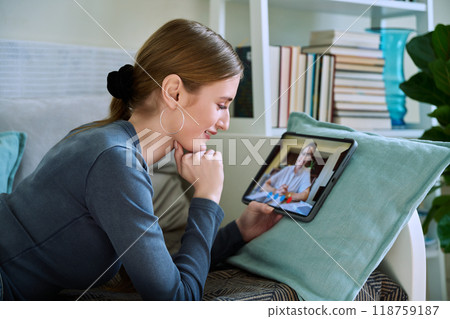 Teenager girl having online video conference therapy with psychologist 118759187