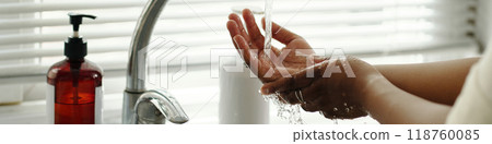Washing Hands Under Running Water by Sink Faucet Washing Hands Under Running Water by Sink Faucet 118760085