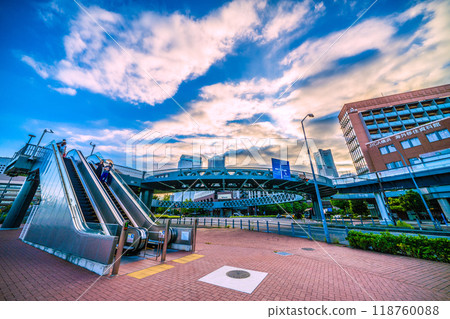 Yokohama cityscape in Japan. Shinko Circle Walk and escalators. Yokohama Landmark Tower in the far right. 118760088