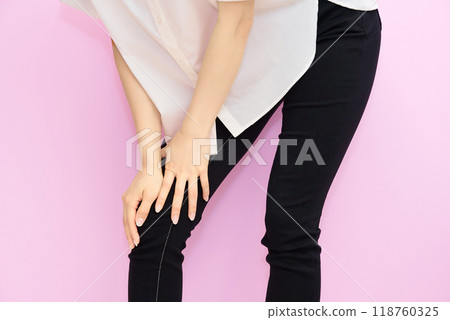 Woman worried about foot pain 118760325
