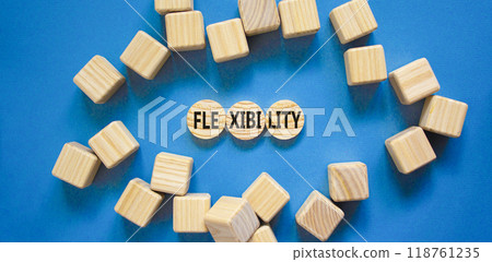 Flexibility symbol. Concept word Flexibility on beautiful wooden circles. Beautiful blue table blue background. Wooden cubes. Business flexibility concept. Copy space. 118761235