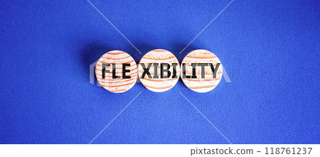 Flexibility symbol. Concept word Flexibility on beautiful wooden circles. Beautiful blue background. Business flexibility concept. Copy space. 118761237