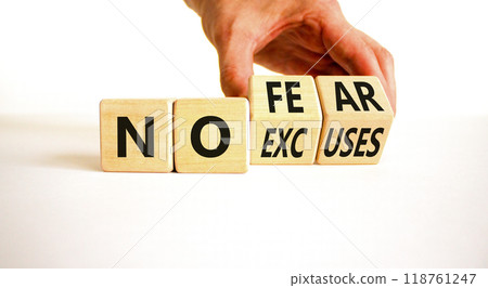 No fear and excuses symbol. Concept words No fear No excuses on wooden block. Beautiful white table white background. Businessman hand. Business motivational no fear and excuses concept. Copy space. 118761247