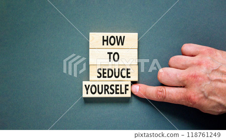 How to seduce yourself symbol. Concept word How to seduce yourself on wooden blocks. Businessman hand. Beautiful grey table grey background. Business and how to seduce yourself concept. Copy space. How to seduce yourself symbol. Concept word How to seduce yourself on wooden blocks. Businessman hand. Beautiful grey table grey background. Business and how to seduce yourself concept. Copy space. 118761249