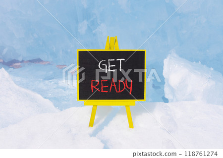 Get ready symbol. Concept words Get ready on beautiful yellow black blackboard. Beautiful blue ice background. Business, support, motivation and get ready concept. Copy space. Get ready symbol. Concept words Get ready on beautiful yellow black blackboard. Beautiful blue ice background. Business, support, motivation and get ready concept. Copy space. 118761274