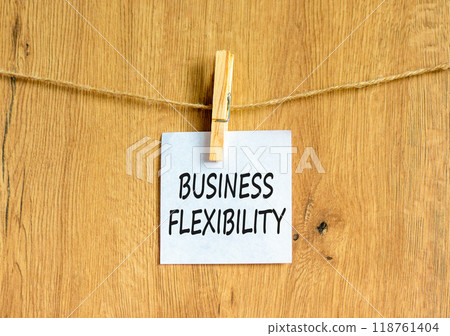 Business flexibility symbol. Concept words Business flexibility on beautiful white paper on wooden clothespin. Beautiful wooden background. Business flexibility concept. Copy space. 118761404