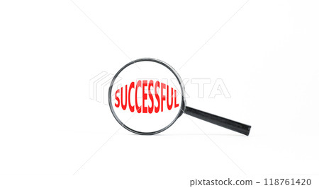 Successful symbol. Concept word Successful in beautiful magnifying glass. Beautiful white paper background. Business successful concept. Copy space. 118761420