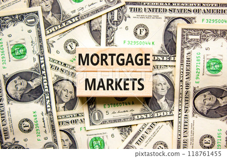 Mortgage markets symbol. Concept words Mortgage markets on beautiful wooden blocks. Dollar bills. Beautiful background from dollar bills. Business mortgage markets concept. Copy space. Mortgage markets symbol. Concept words Mortgage markets on beautiful wooden blocks. Dollar bills. Beautiful background from dollar bills. Business mortgage markets concept. Copy space. 118761455